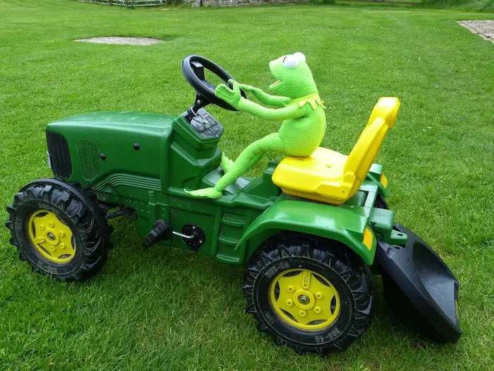 a frog on riding lawn mower